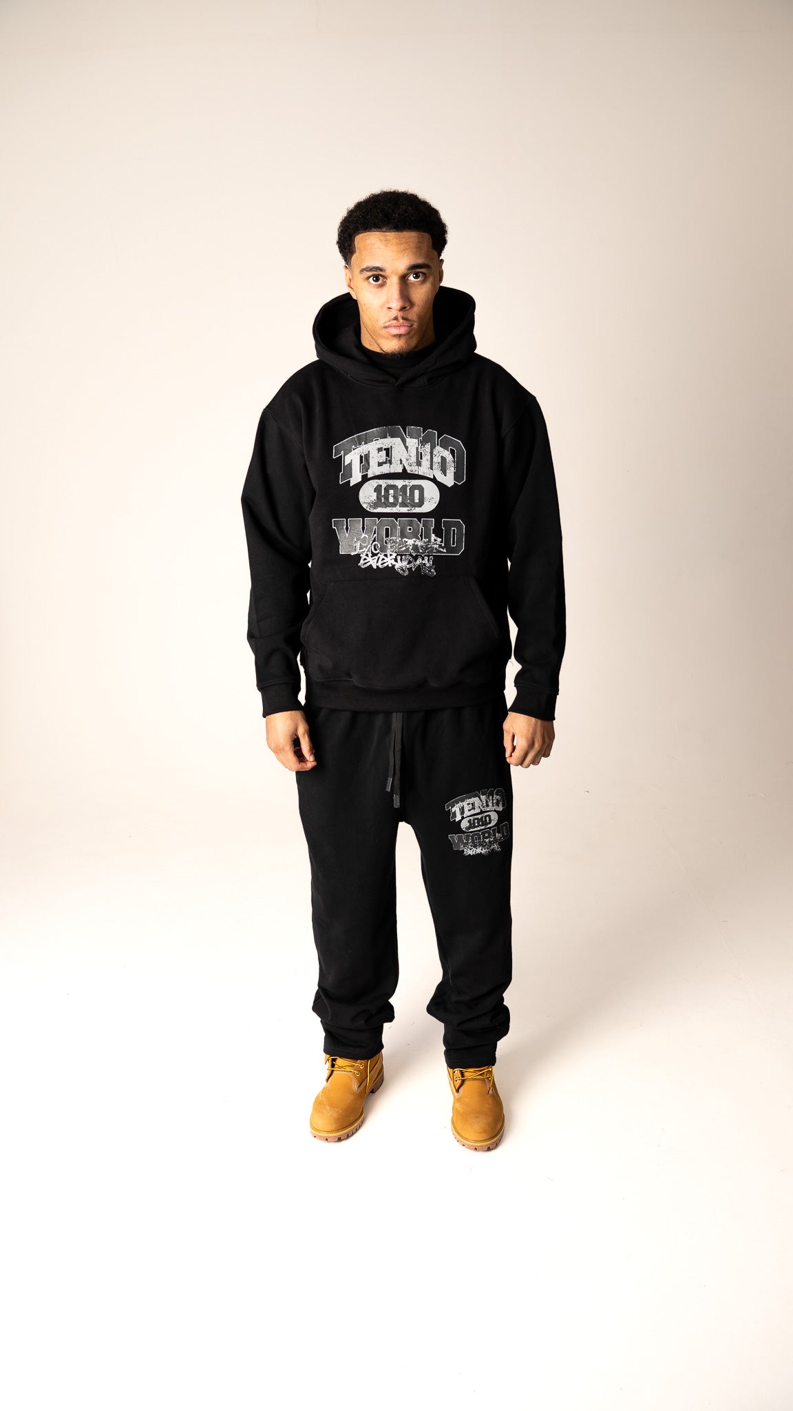 Black and grey 1% Better Everyday heavyweight tracksuit from Ten10, featuring bold branding and a comfortable, stylish design for daily progress and growth.
