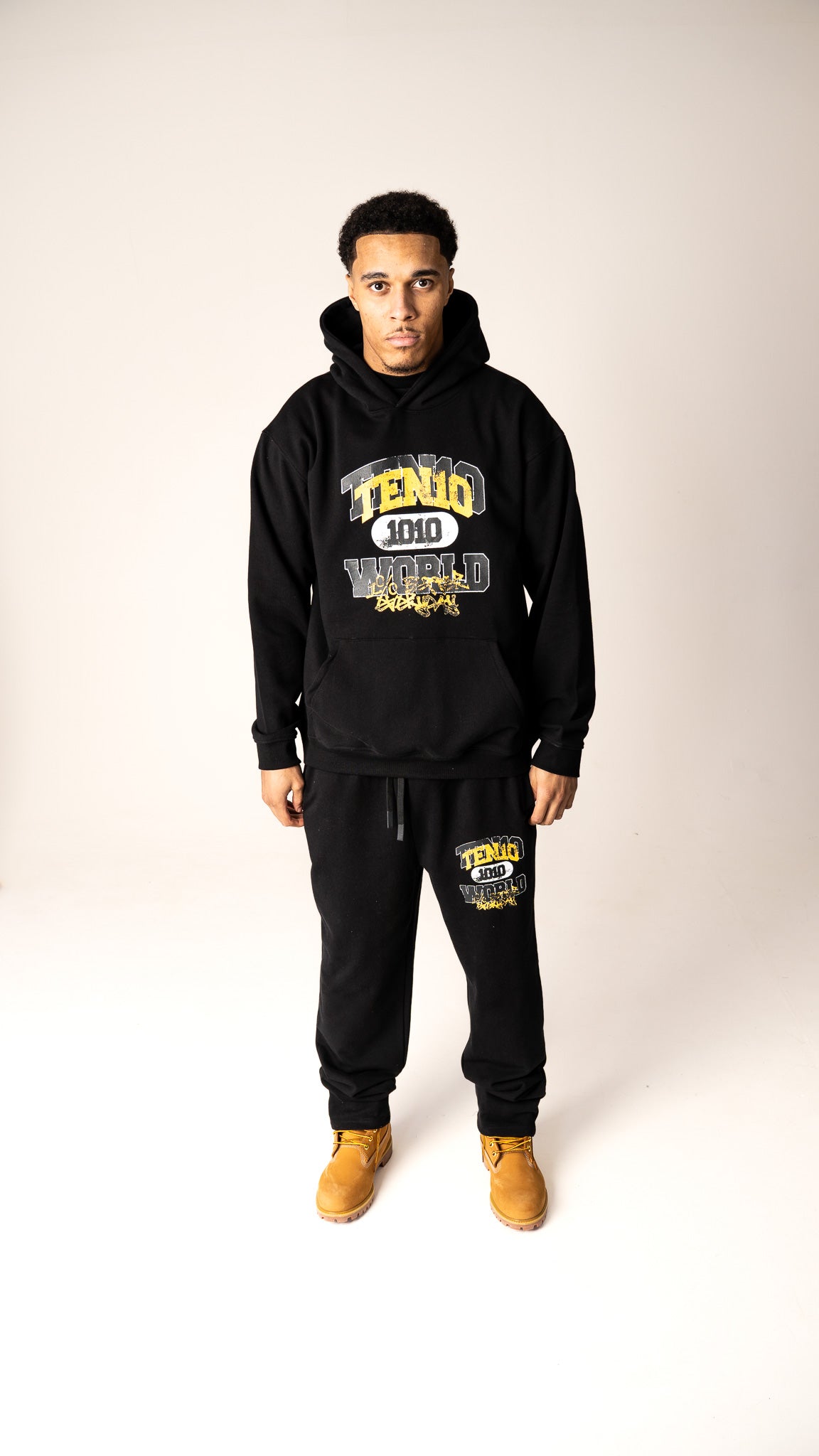 Black and Yellow 1% Better Everyday heavyweight tracksuit from Ten10, featuring bold branding and a comfortable, stylish design for daily progress and growth.