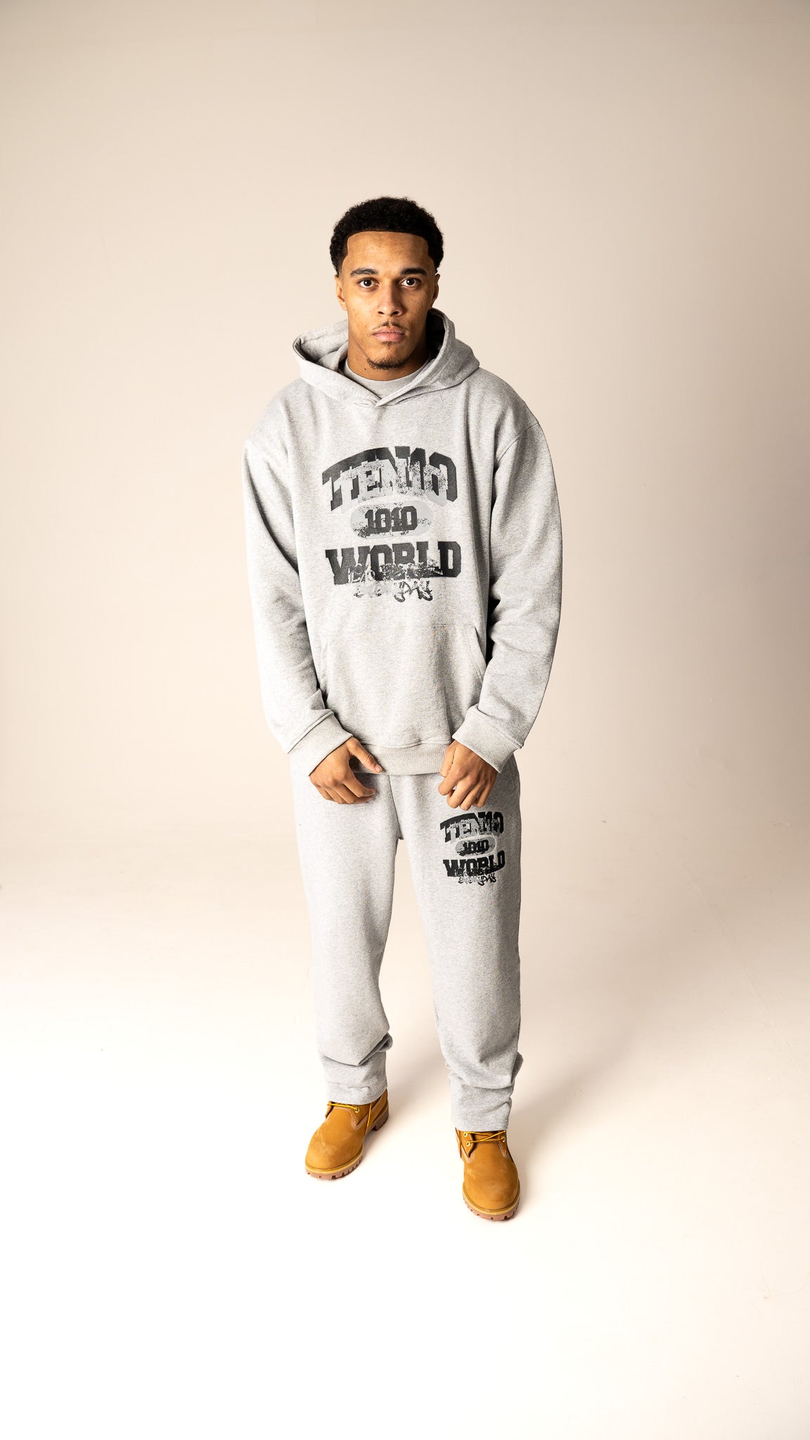 Grey and grey 1% Better Everyday heavyweight tracksuit from Ten10, featuring bold branding and a comfortable, stylish design for daily progress and growth.